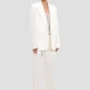 Chaqueta con solapas desmontables en color blanco roto Chaqueta con solapas desmontables en color blanco roto