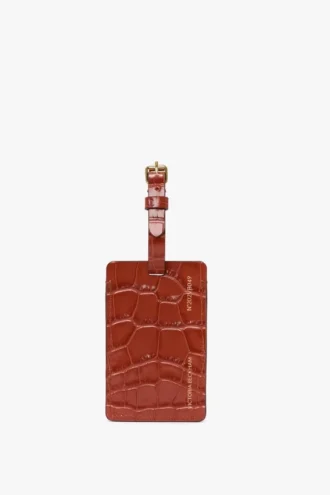 Etiqueta para equipaje en piel con relieve de cocodrilo en rojo ladrillo