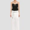 Pantalón recto con vuelta en color blanco roto Pantalón recto con vuelta en color blanco roto