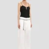 Pantalón recto con vuelta en color blanco roto Pantalón recto con vuelta en color blanco roto